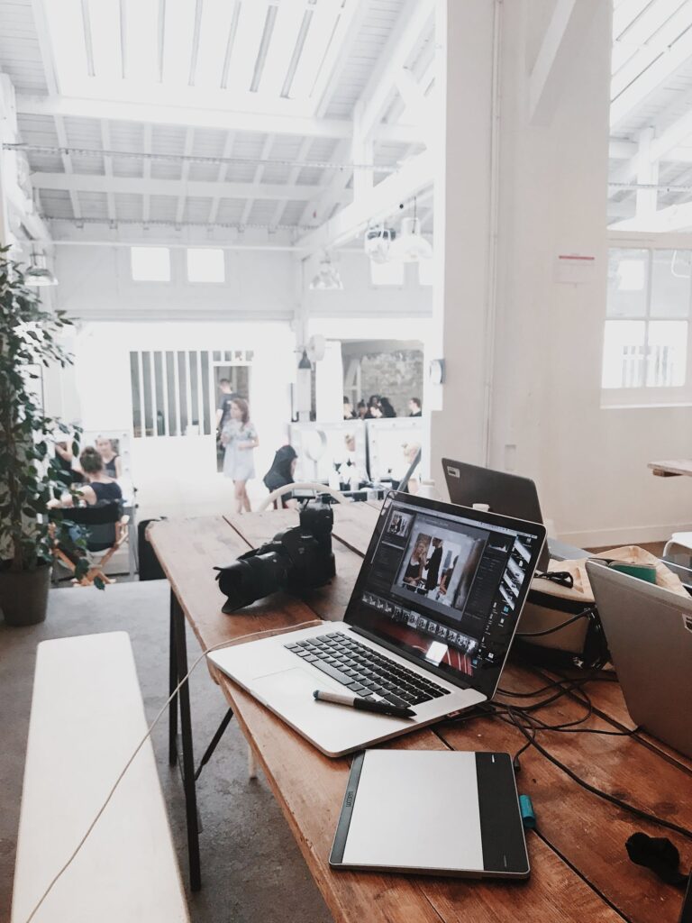 A graphic design assistant creating visuals on a computer, symbolizing creative design support.